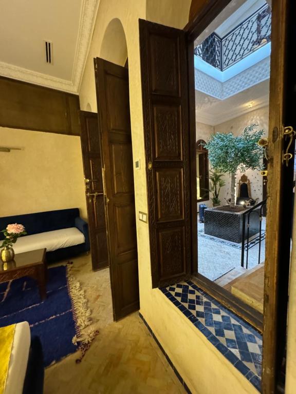 an open door to a living room with a couch at Riad M'Barka in Tangier