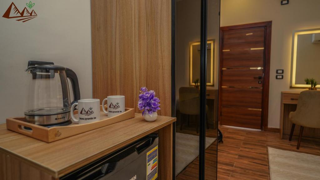 Kuchyň nebo kuchyňský kout v ubytování Suzana Pyramids hotel