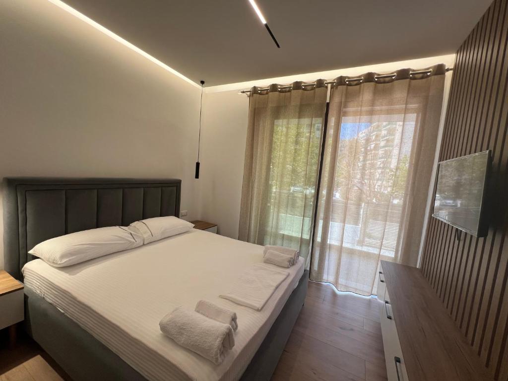 Postel nebo postele na pokoji v ubytování Vlora Sunset Rooms