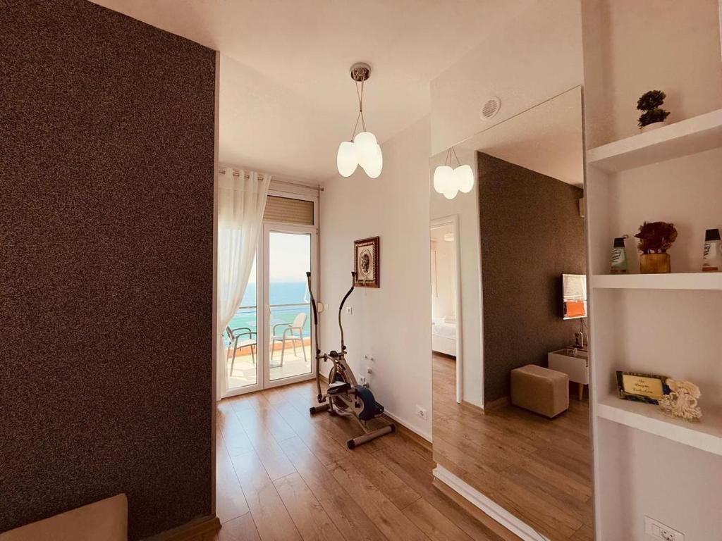 a living room with a view of the ocean at The Blue Horizon in Vlorë
