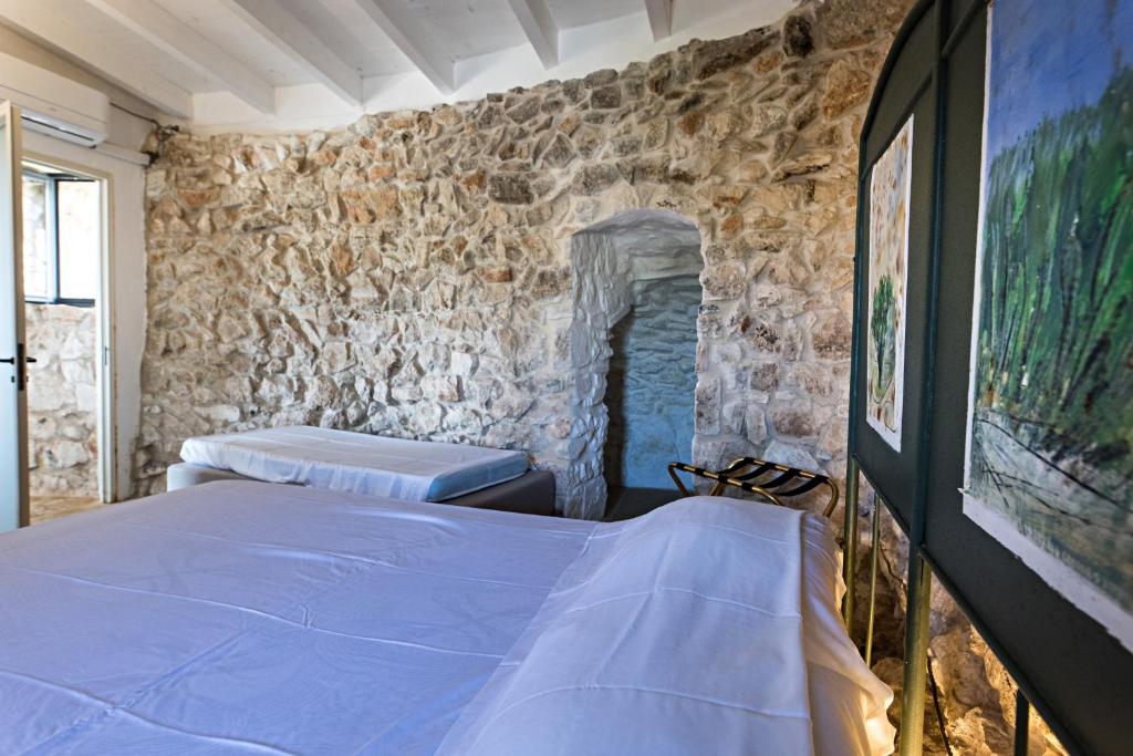 Postel nebo postele na pokoji v ubytování Feudo - Pajara Curte 3 by Salento Prime
