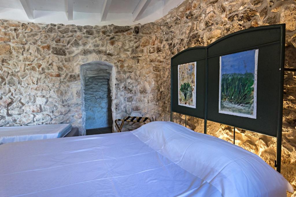 Postel nebo postele na pokoji v ubytování Feudo - Pajara Curte 3 by Salento Prime