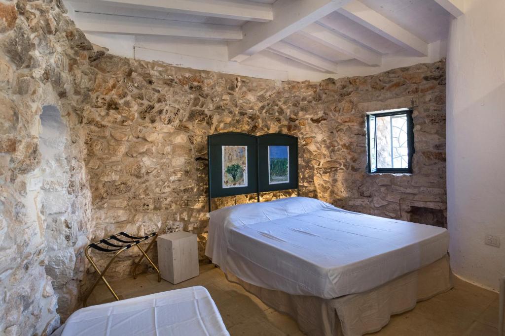Postel nebo postele na pokoji v ubytování Feudo - Pajara Curte 3 by Salento Prime