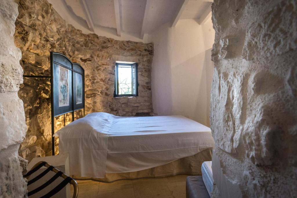 Postel nebo postele na pokoji v ubytování Feudo - Pajara Curte 3 by Salento Prime