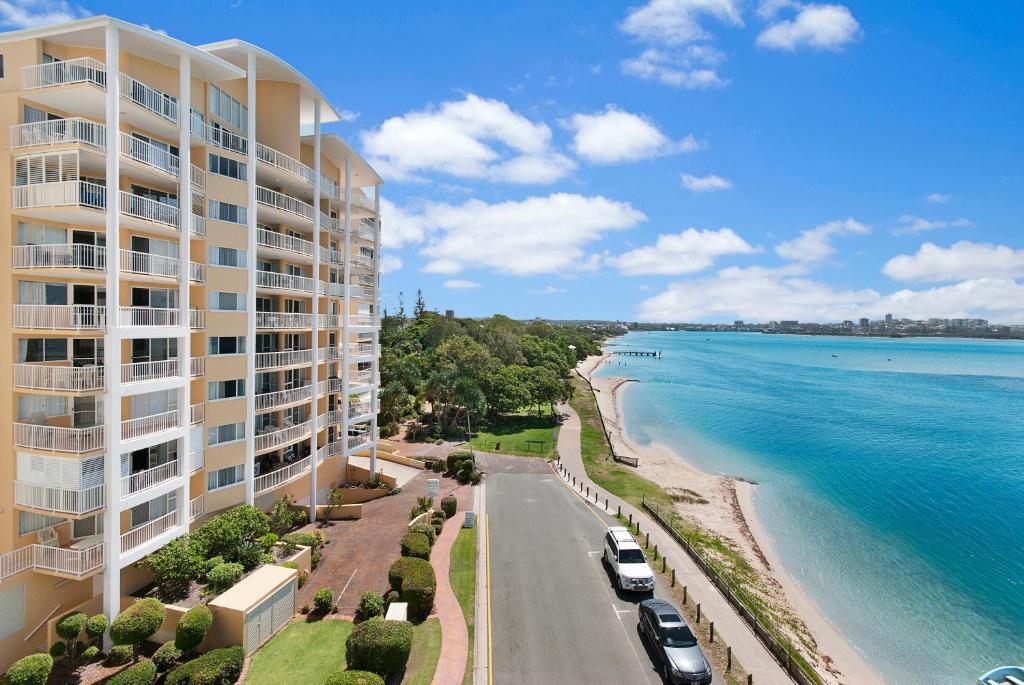 an aerial view of a building next to the ocean at Riviere on Golden Beach in Caloundra