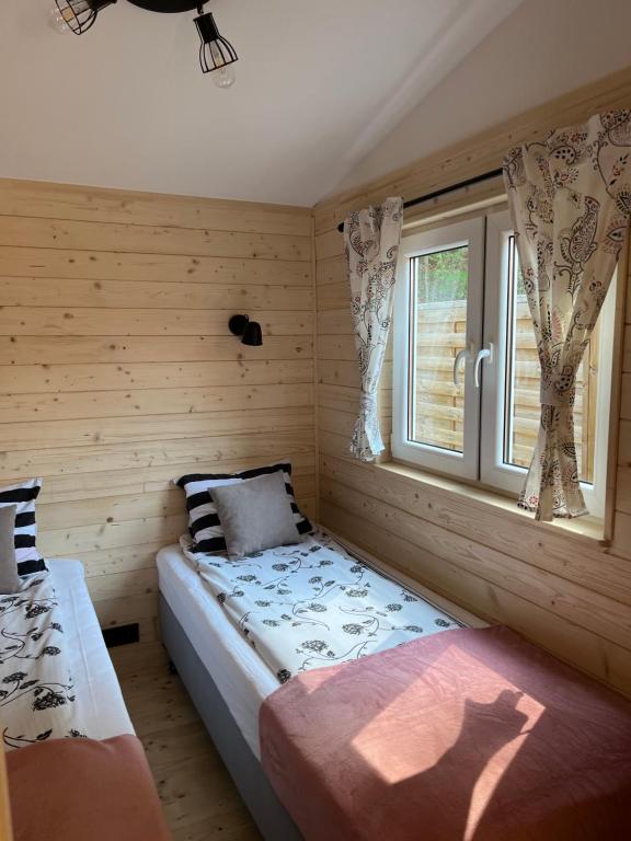Posteľ alebo postele v izbe v ubytovaní Domek Romanówka