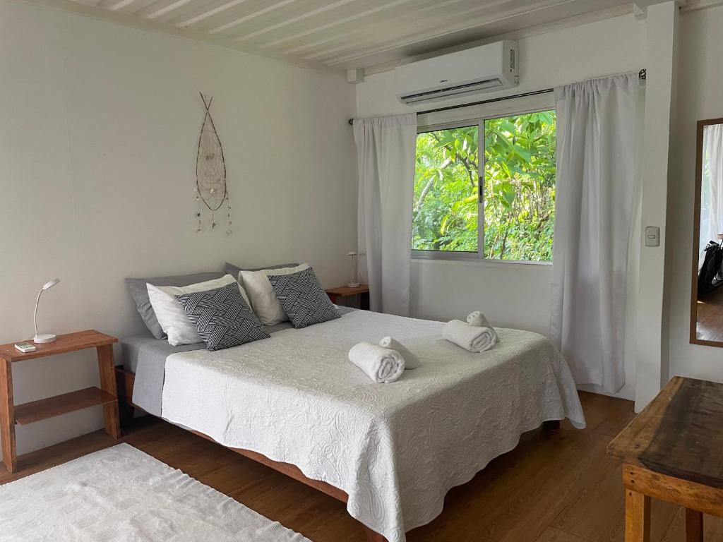 Ένα ή περισσότερα κρεβάτια σε δωμάτιο στο Nahele Lodge