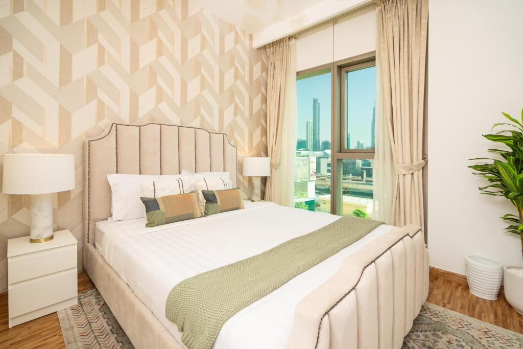 Postel nebo postele na pokoji v ubytování Prime Retreats @ Downtown Views by Emaar