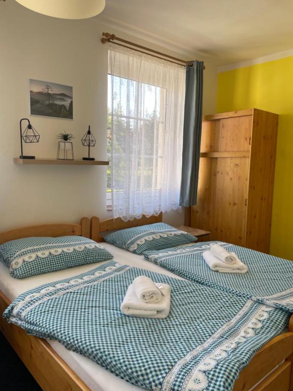 Postel nebo postele na pokoji v ubytování Pension Pastis