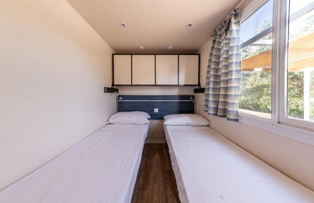 Letto o letti in una camera di Agriturismo l' Annunziata