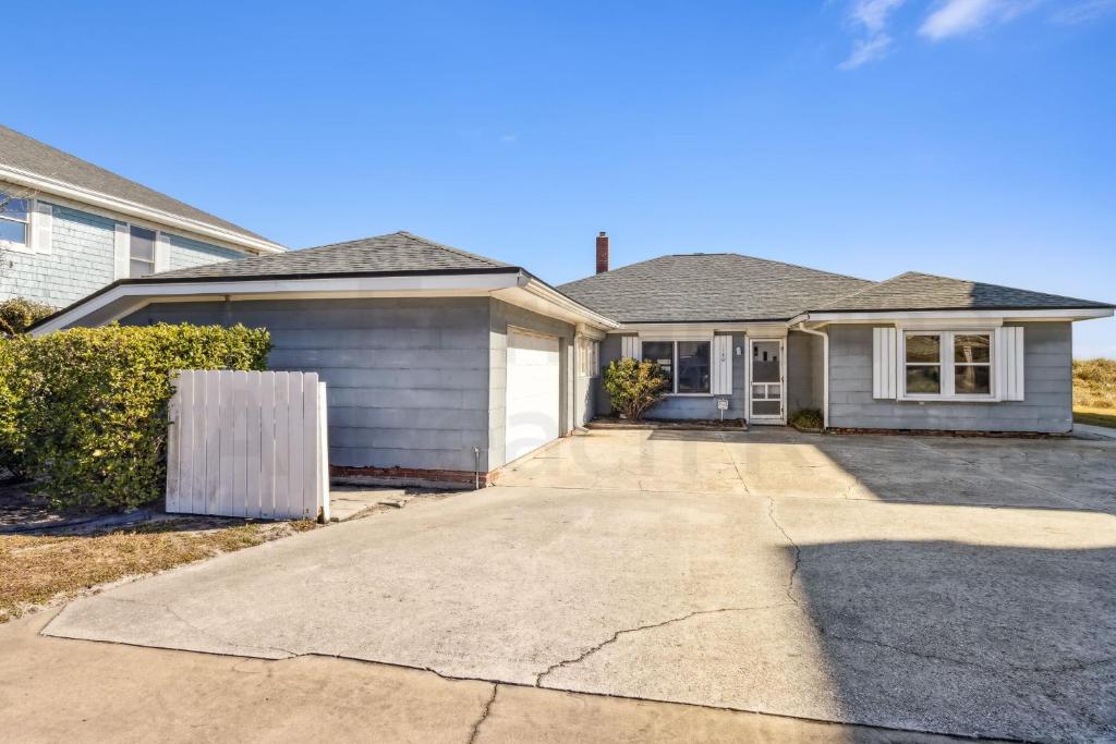 a house with a driveway in front of it at 1180 S Fletcher Ave in Fernandina Beach