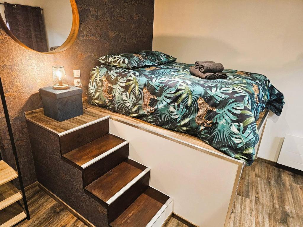 a bedroom with a bed with a teddy bear on it at Mitrons - Apt A in Saint-Affrique