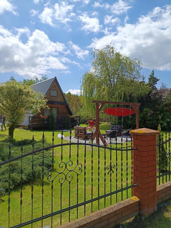 a wrought iron fence in front of a house at Domek u Marty in Solina