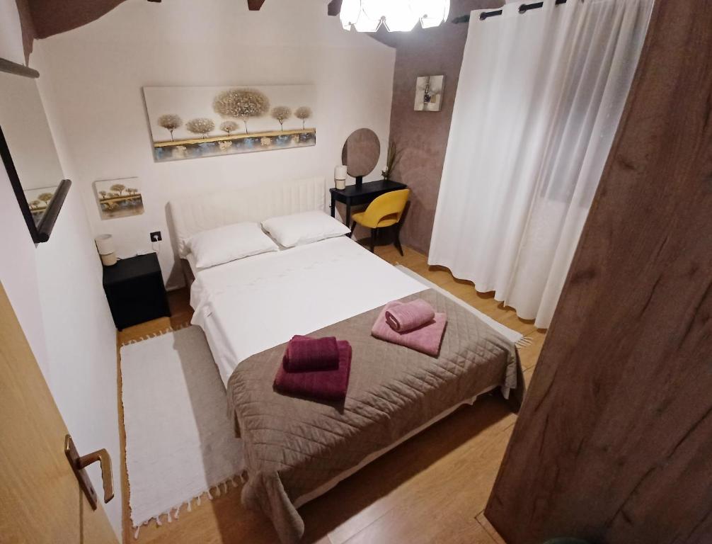 Postel nebo postele na pokoji v ubytování Apartman Marija