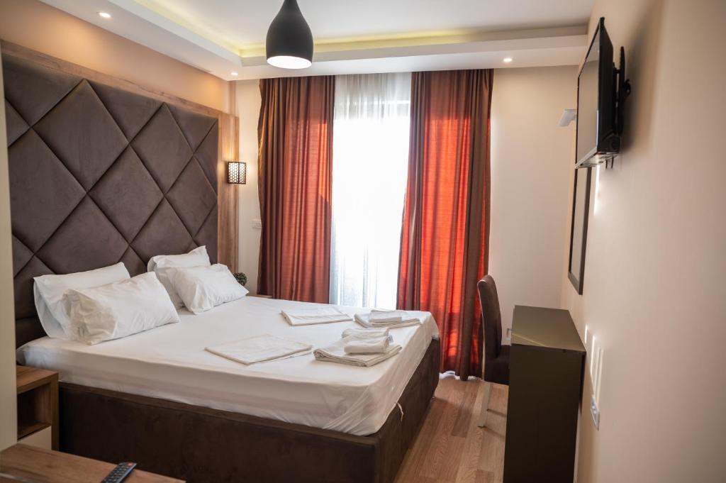 Postel nebo postele na pokoji v ubytování Hotel Evropa