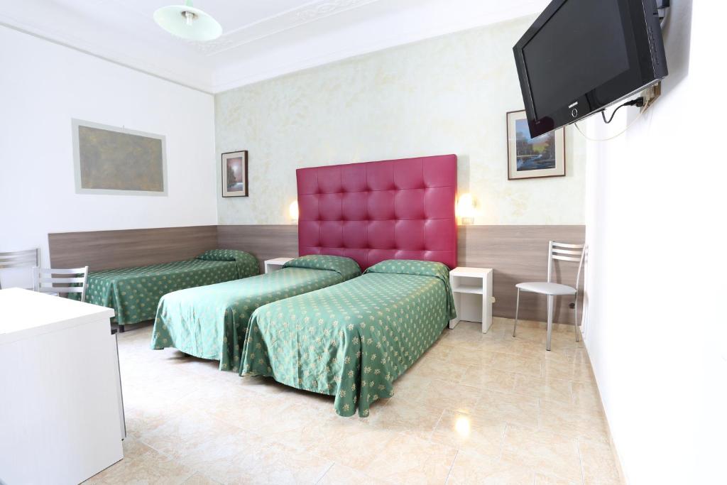TV a/nebo společenská místnost v ubytování Hotel Piola