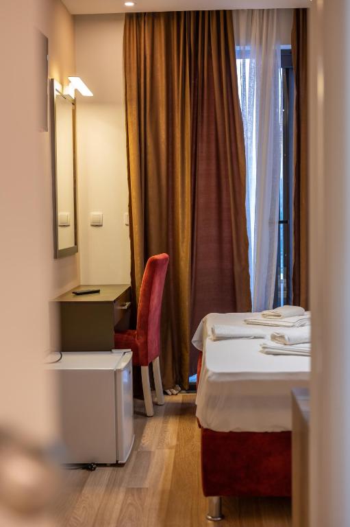 Postel nebo postele na pokoji v ubytování Hotel Evropa