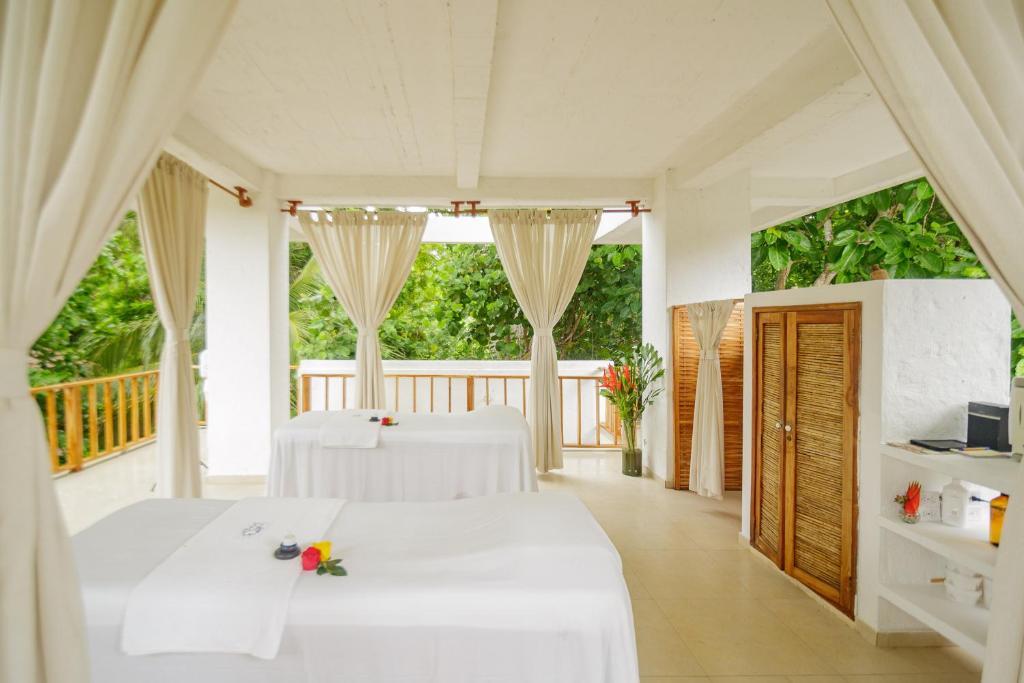 Postel nebo postele na pokoji v ubytování Hotel San Pedro de Majagua