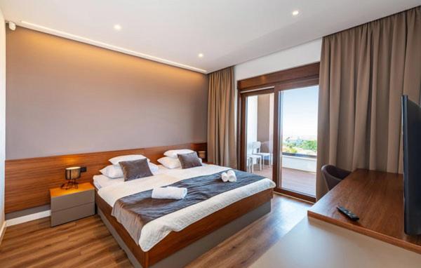 Łóżko lub łóżka w pokoju w obiekcie Villa Estate