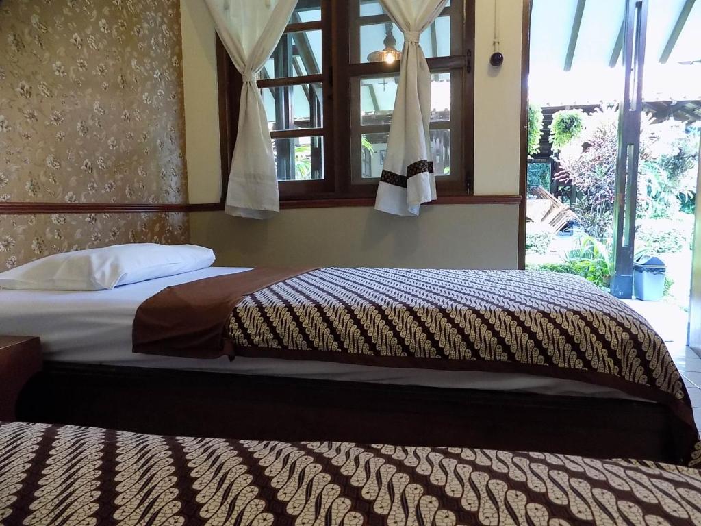 Postel nebo postele na pokoji v ubytování Delta Homestay