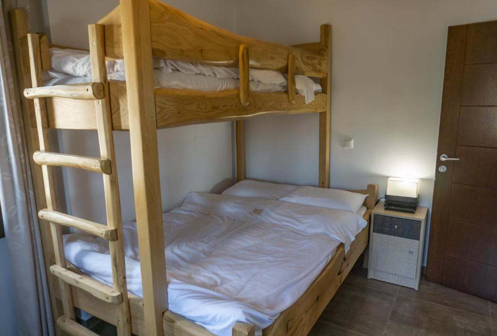 Postel nebo postele na pokoji v ubytování Mansion Chalatsopoulos