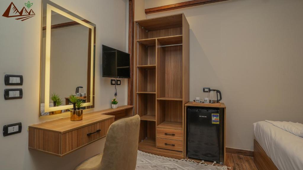 Kuchyň nebo kuchyňský kout v ubytování Suzana Pyramids hotel