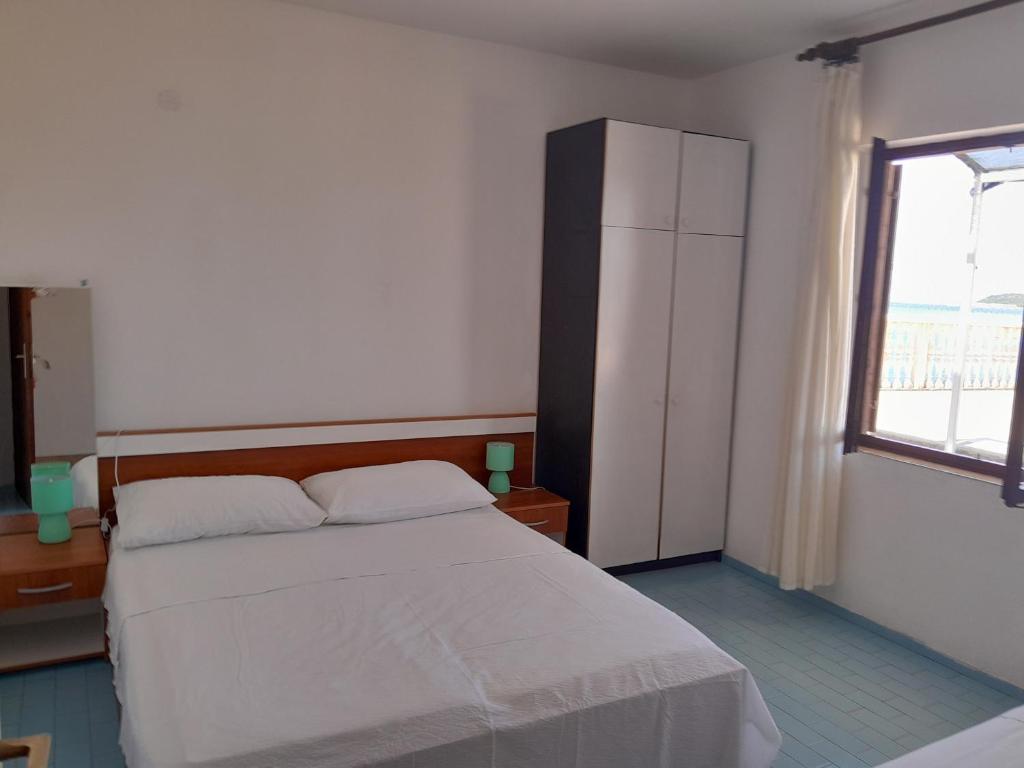 Posteľ alebo postele v izbe v ubytovaní Apartment Pjestata 14440e