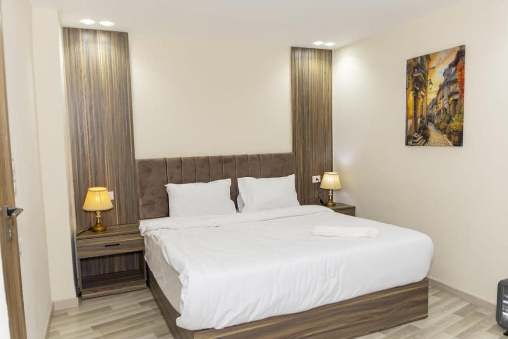 Postel nebo postele na pokoji v ubytování Maktub Pyramids Hotel