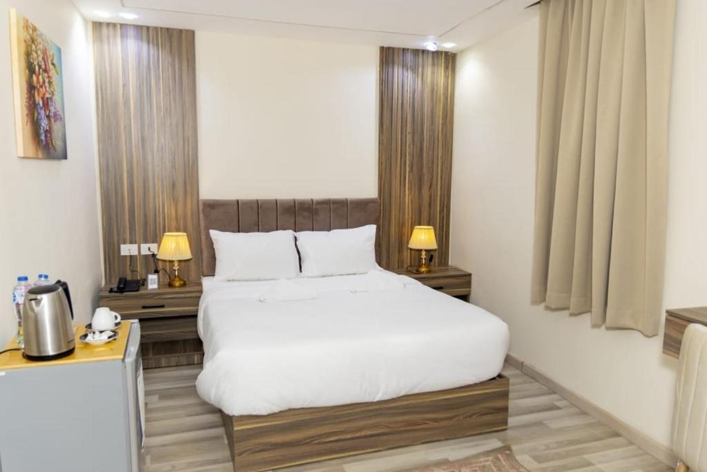Postel nebo postele na pokoji v ubytování Maktub Pyramids Hotel