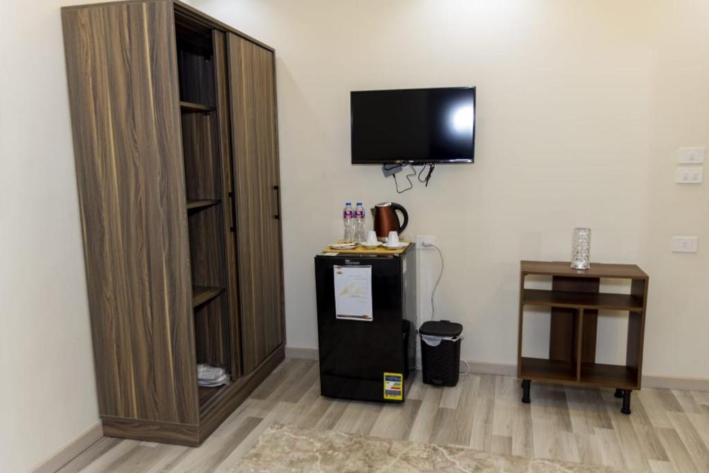 TV a/nebo společenská místnost v ubytování Maktub Pyramids Hotel