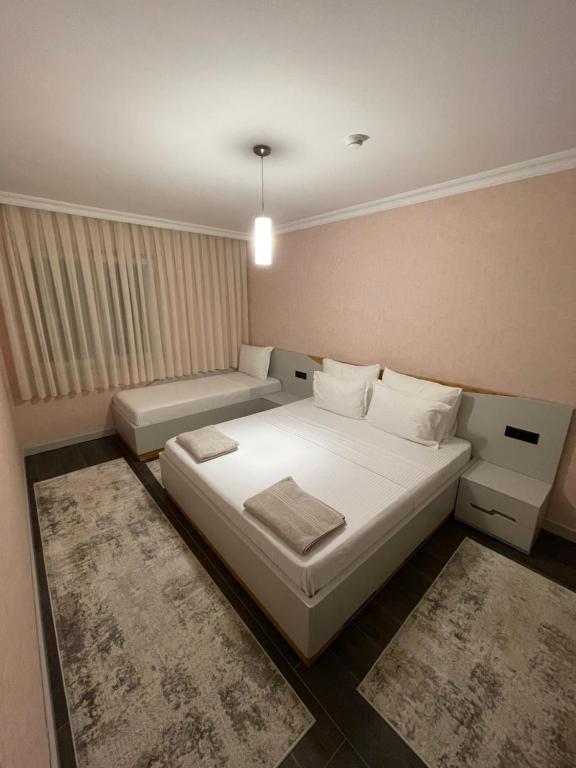 Postel nebo postele na pokoji v ubytování Apartament Koha