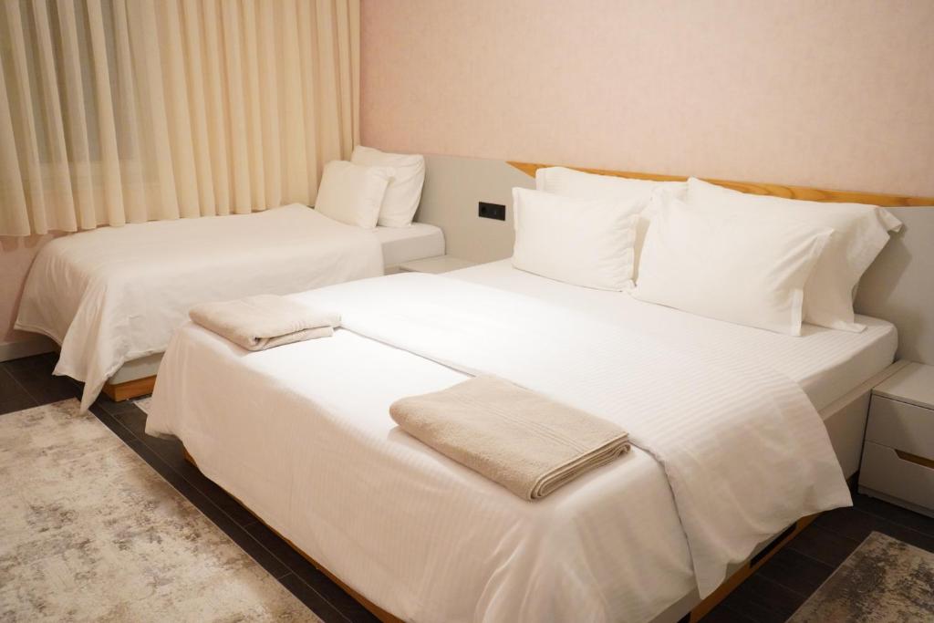 Postel nebo postele na pokoji v ubytování Apartament Koha