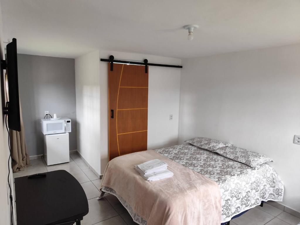 Ένα ή περισσότερα κρεβάτια σε δωμάτιο στο Casa di Heitor - Suítes