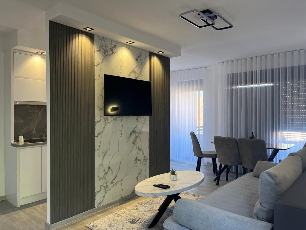 a living room with a couch and a table at Asteris Apartments in Demir Kapija