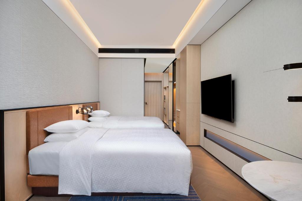 Postel nebo postele na pokoji v ubytování Four Points by Sheraton Suzhou Gusu