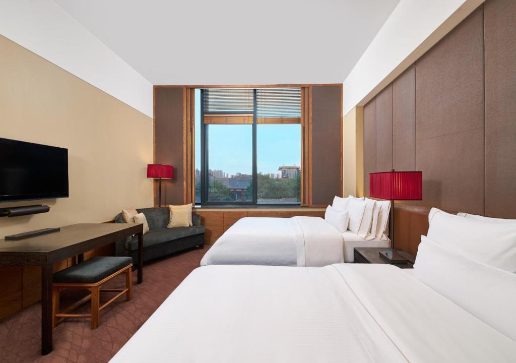 Postel nebo postele na pokoji v ubytování The Westin Xi'an