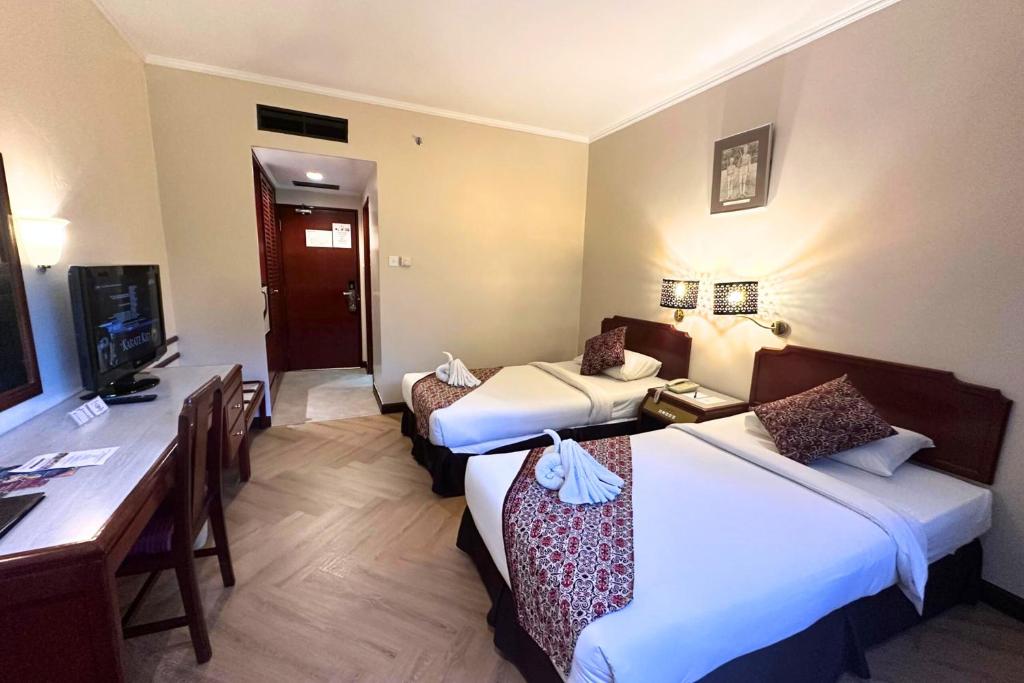 Postel nebo postele na pokoji v ubytování Hotel Shangri-la Kota Kinabalu
