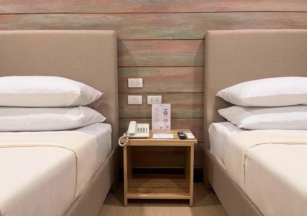 Postel nebo postele na pokoji v ubytování Sola Hotel