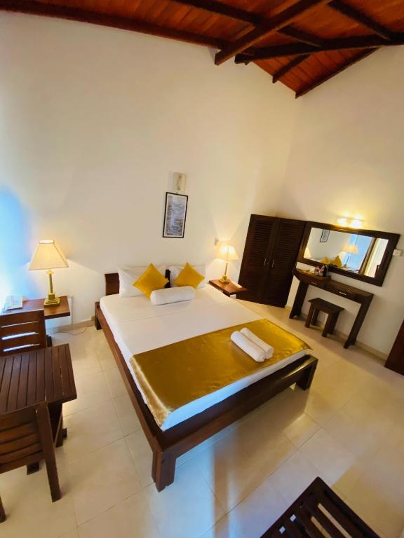 Postel nebo postele na pokoji v ubytování Kandy Highland Unique Hotel