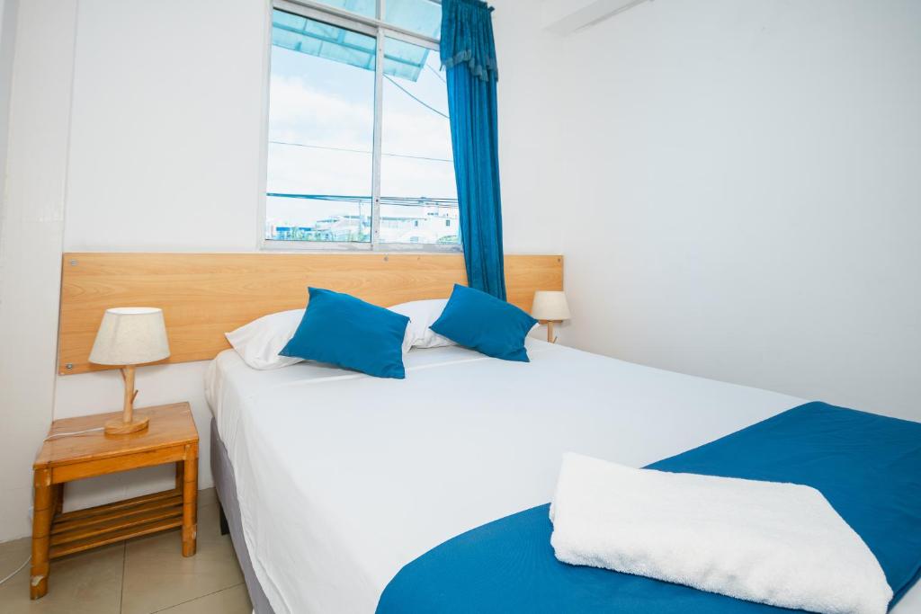 Postel nebo postele na pokoji v ubytování Hotel Casa Latina