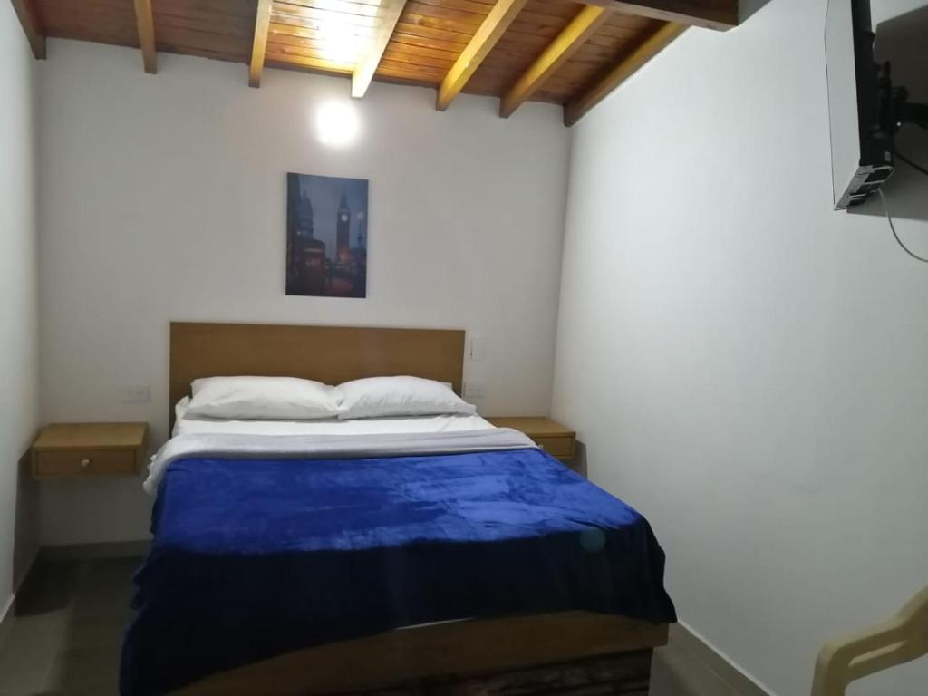 Postel nebo postele na pokoji v ubytování Hotel Olímpica