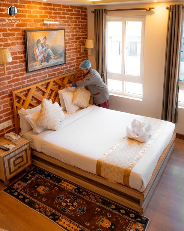 Postel nebo postele na pokoji v ubytování Hotel Kesu Home