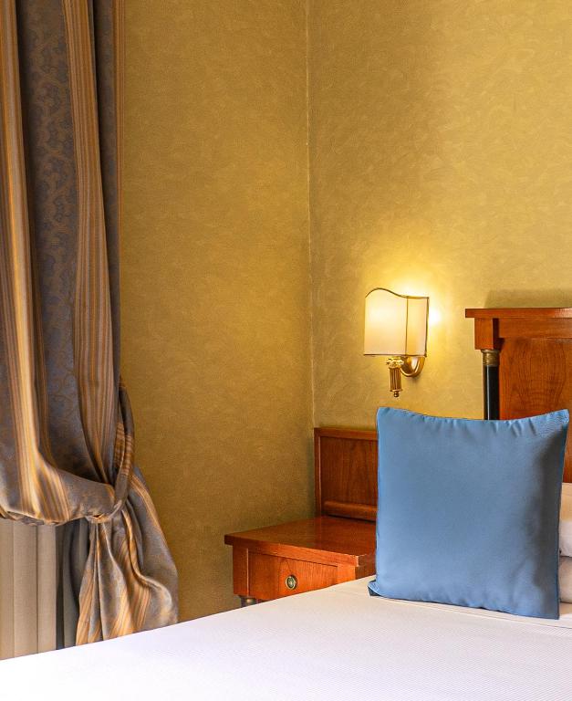 Postel nebo postele na pokoji v ubytování Hotel Miami