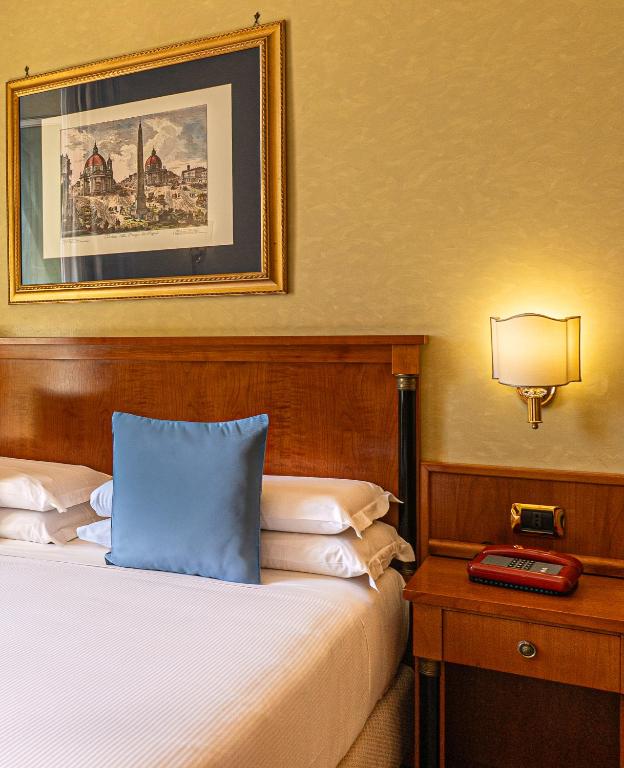 Postel nebo postele na pokoji v ubytování Hotel Miami