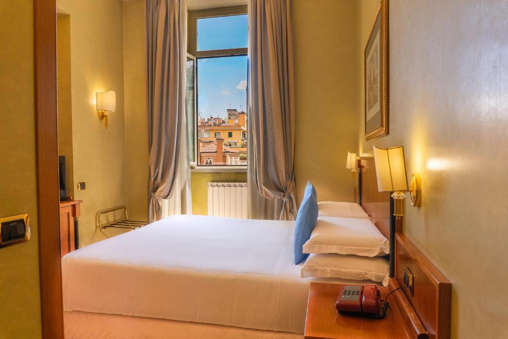 Postel nebo postele na pokoji v ubytování Hotel Miami