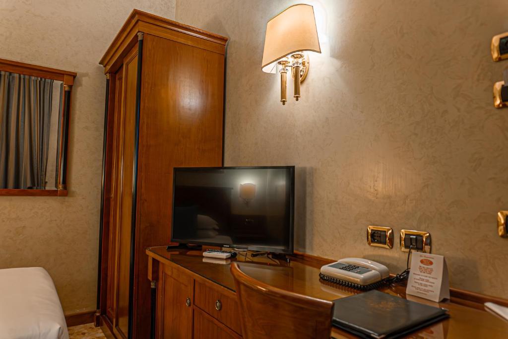 TV a/nebo společenská místnost v ubytování Hotel Miami
