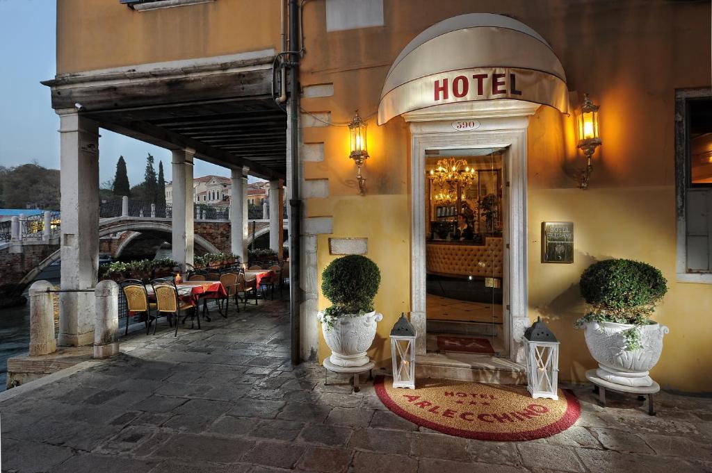 a hotel with plants in front of a building at Hotel Arlecchino in Venice
