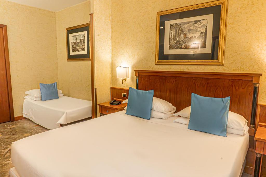 Postel nebo postele na pokoji v ubytování Hotel Miami