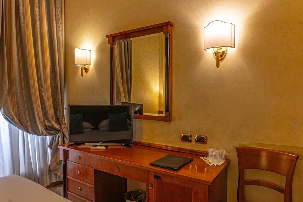 TV a/nebo společenská místnost v ubytování Hotel Miami