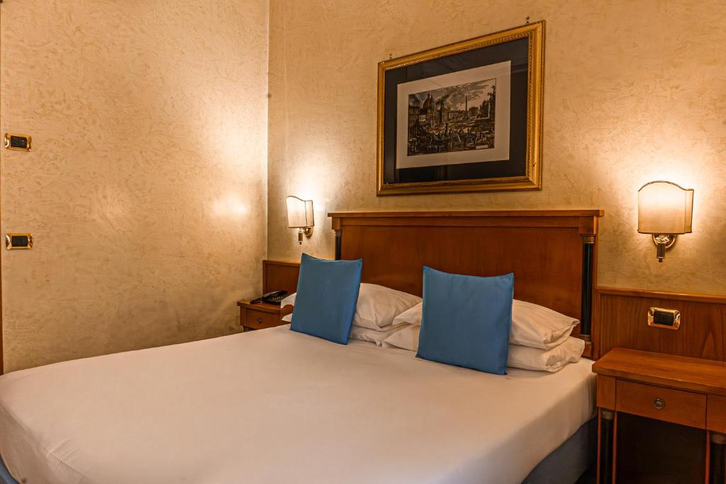 Postel nebo postele na pokoji v ubytování Hotel Miami